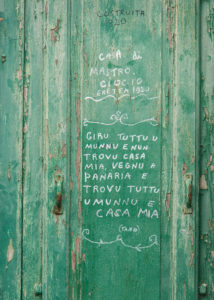 Sicily - Sunny impressions of the Aeolian Islands, also known as the Aeolian Islands or Isole Eolie. Lettering on a door in Panarea: "I travel the whole world and cannot find a home, I come to Panarea and find the whole world and my home". Sicily - Sunny impressions of the Aeolian Islands, also known as the Aeolian Islands or Isole Eolie. Lettering on a door in Panarea: "I travel the whole world and cannot find a home, I come to Panarea and find the whole world and my home".